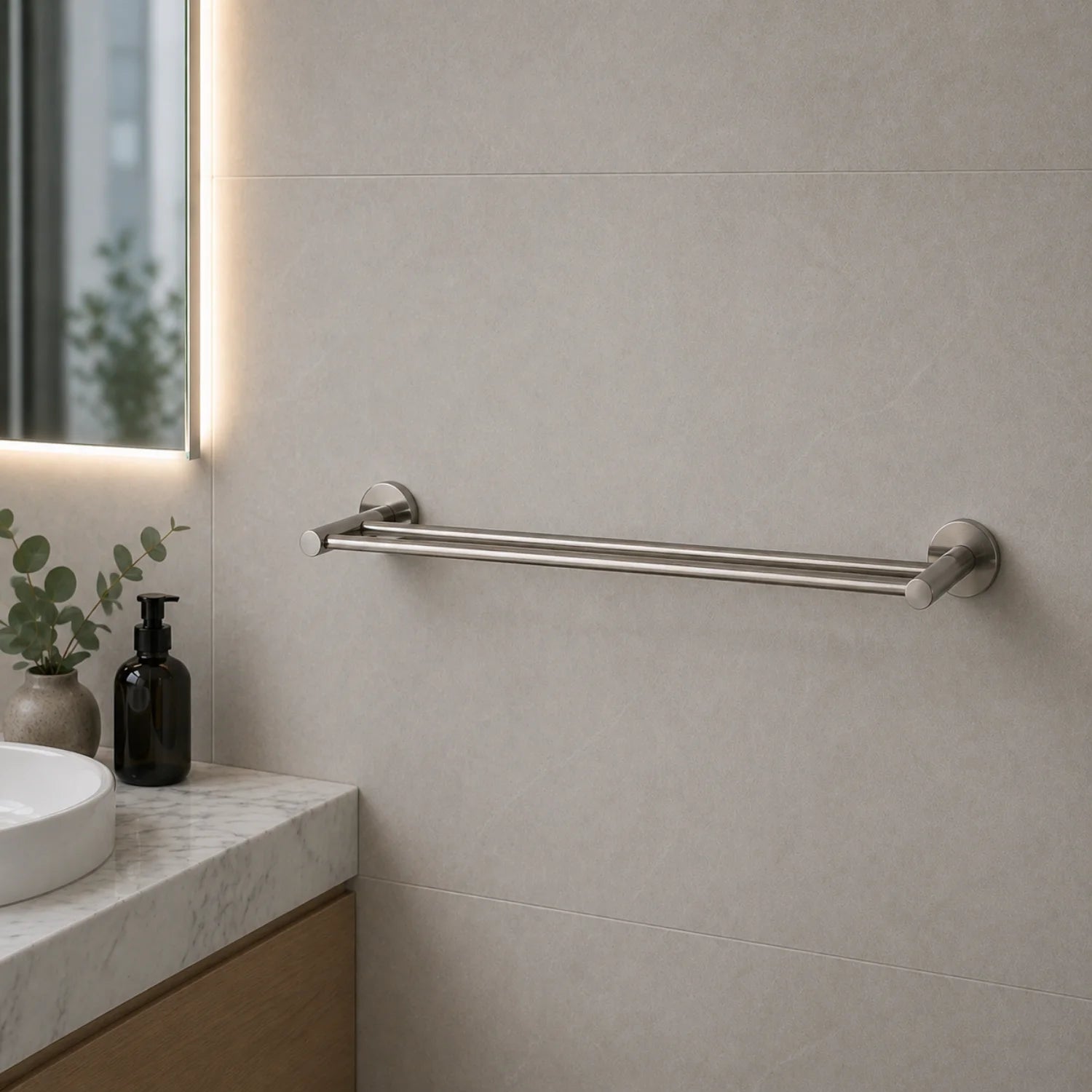 Bathroom setting with a towel rail on a tiled wall, sink, and decorative elements.