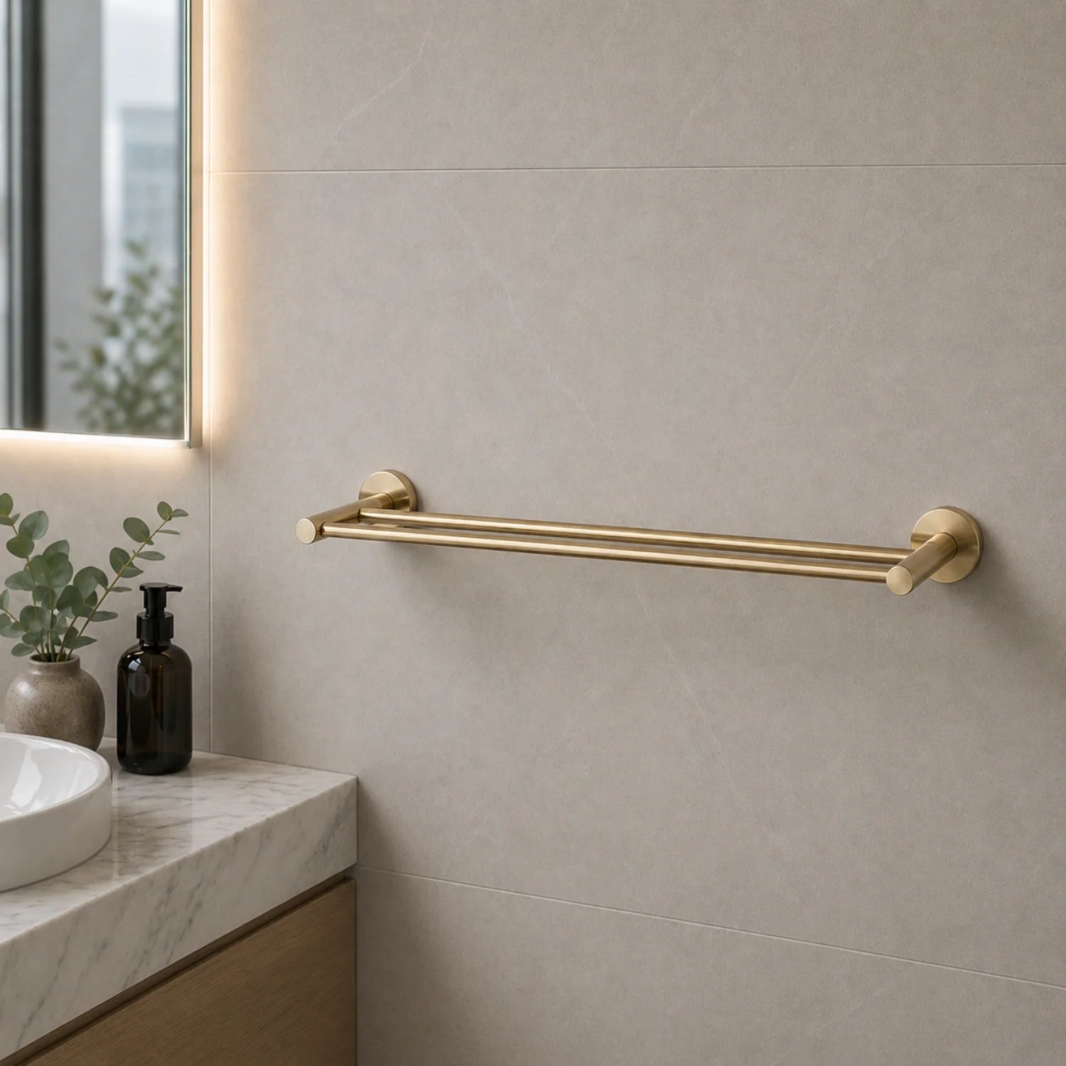 Gold towel bar mounted on a bathroom wall with a neutral color scheme.