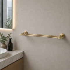 Gold towel bar mounted on a bathroom wall with a neutral color scheme.