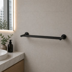 Black towel bar mounted on a tiled bathroom wall with a sink and decorative elements.