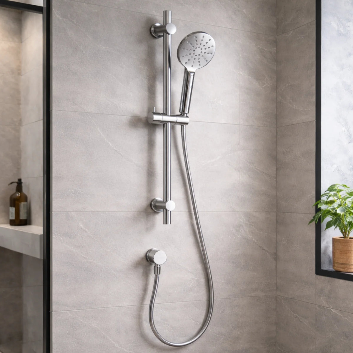 Chrome shower system mounted on a tiled bathroom wall.