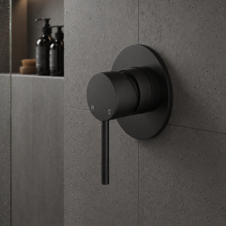 Black shower control valve on a gray tiled wall- Wall Mixer
